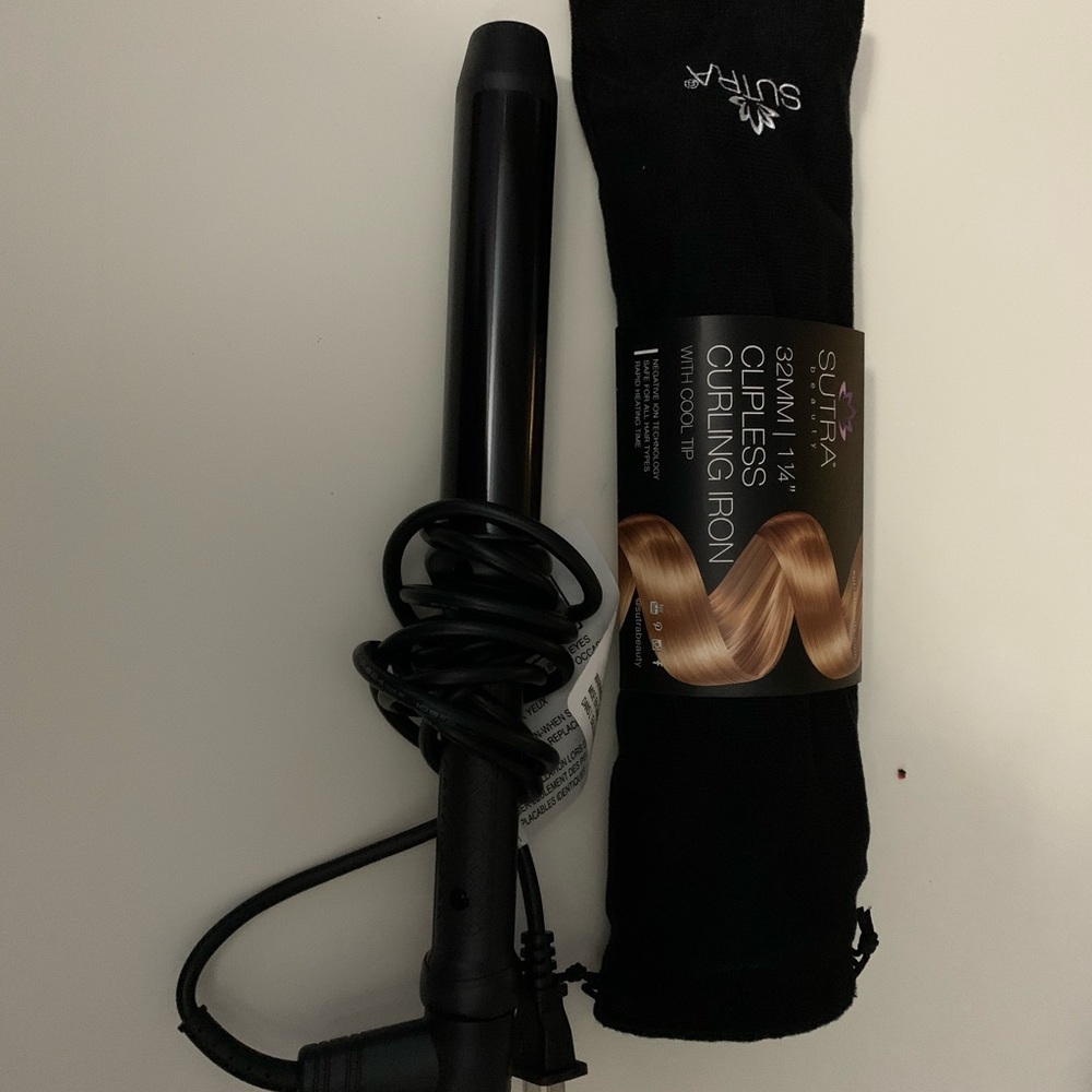 Sutra clipless curling iron